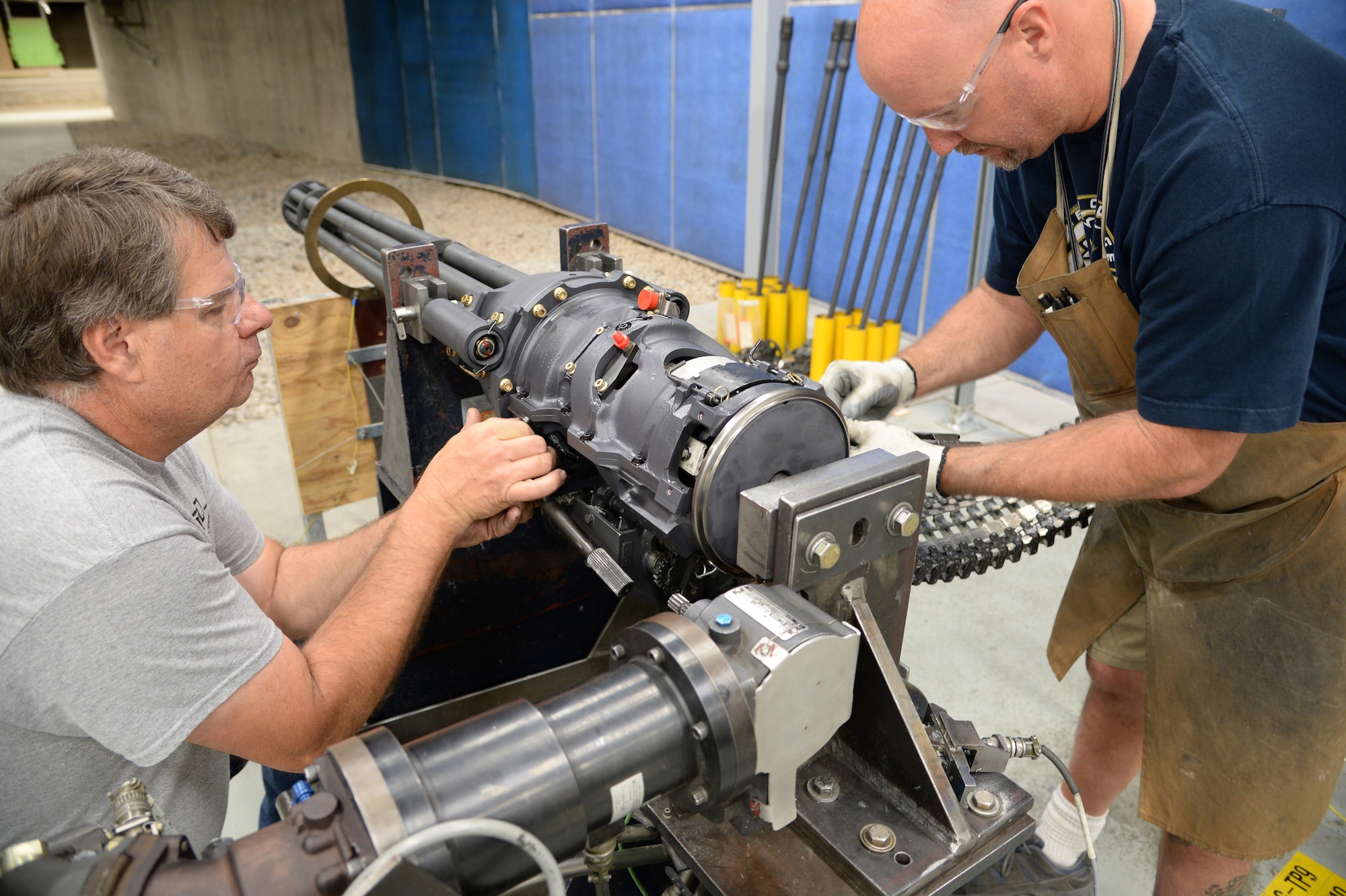 Ken Van Dyk, left, and John Baker, both aircraft ordnance system mechanics assigned to the 531st Commodities Maintenance Squadron, prepare a 20 mm gun for test firing at Hill Air Force Base, Utah, May 25, 2016. The gun shop also overhauls and test fires 30 mm guns for all branches of the military. (U.S. Air Force photo by R. Nial Bradshaw)