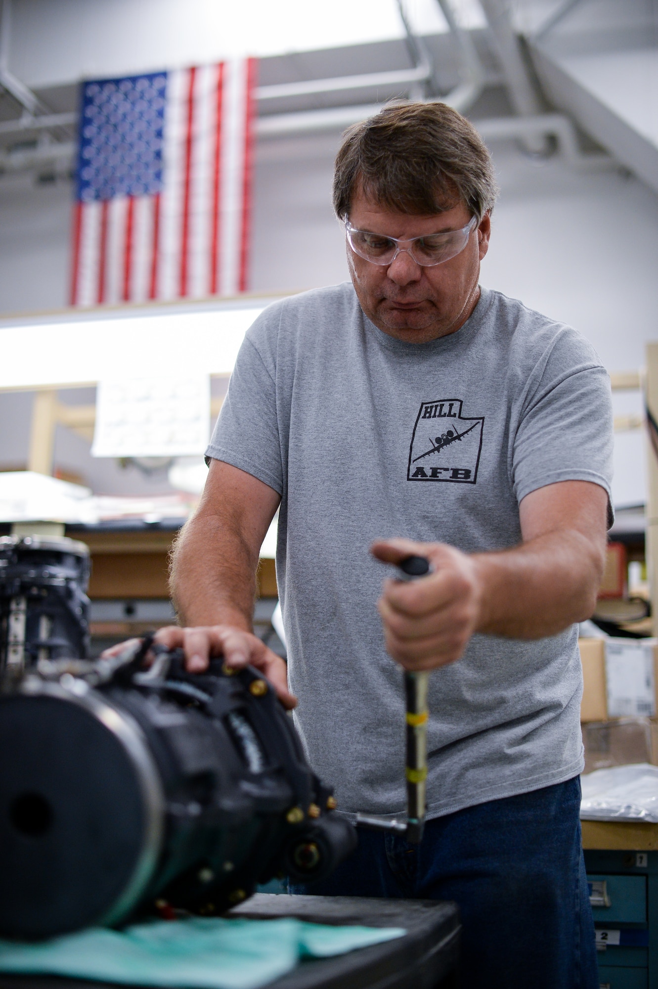 Ken Van Dyk, 531st Commodities Maintenance Squadron, puts the final torque on a 20 mm gun housing before it is to be test fired at Hill Air Force Base, Utah, May 25, 2016. (U.S. Air Force photo by R. Nial Bradshaw)