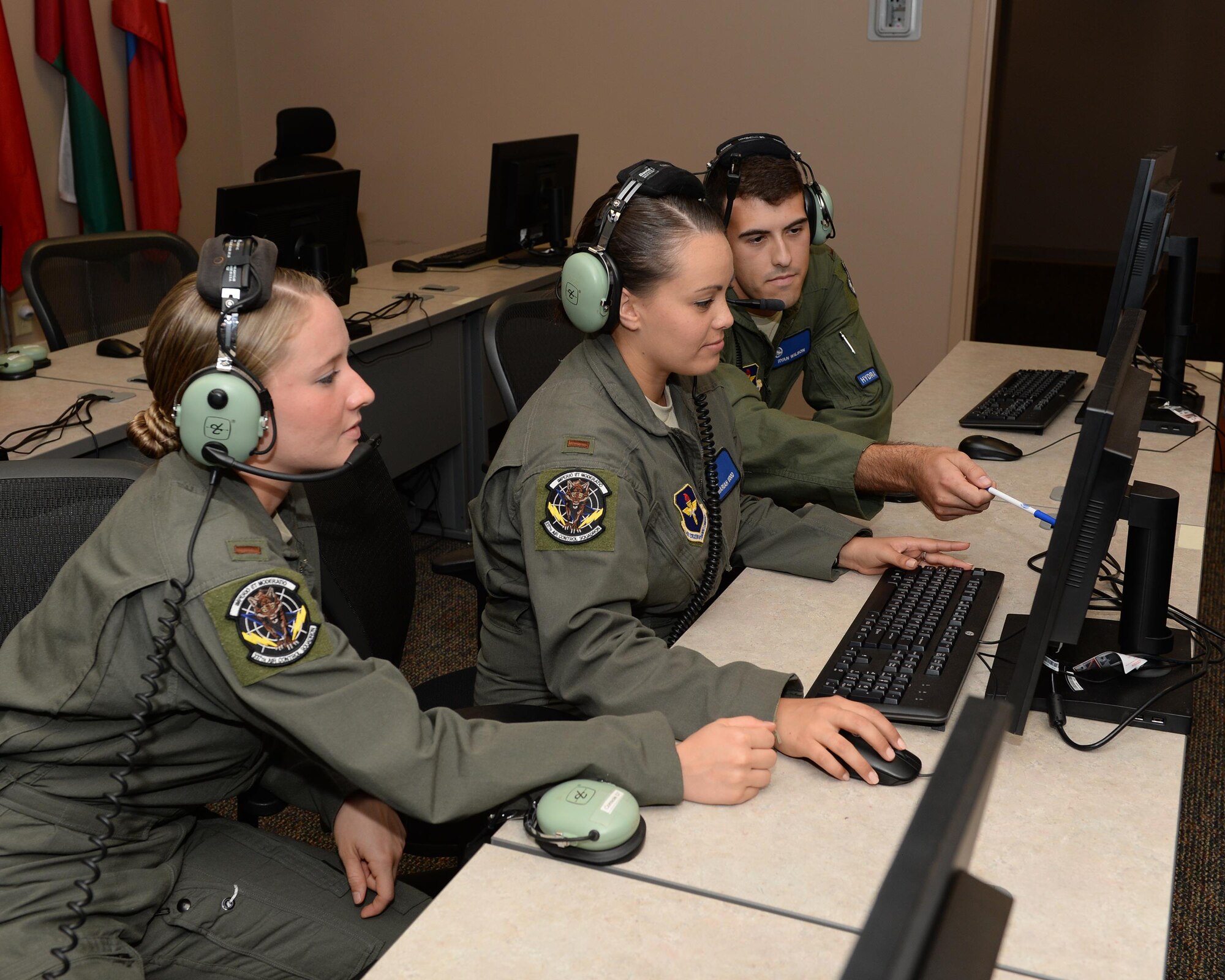Students from the 337th Air Control Squadron monitor simulated battle space during an Undergraduate Air Battle Manager Course training exercise at Tyndall Air Force Base, Fla. July 13, 2016. Individuals who graduate this course are trained and qualified for airborne command and control, air surveillance, electronic warfare, and airborne weapons capabilities in aircraft. (U.S. Air Force photo by Airman 1st Class Cody R. Miller/Released) 