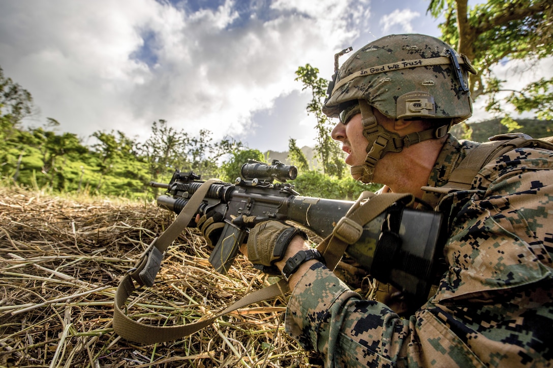 Marine Lance Cpl. Nathan H. Steed fires downrange during training with Fijian soldiers on Ovalau, Fiji, July 13, 2016. Marines and sailors shared engineering and infantry skills with Fijian troops to secure relationships and interoperability. Marine Corps photo by Lance Cpl. Jesus McCloud