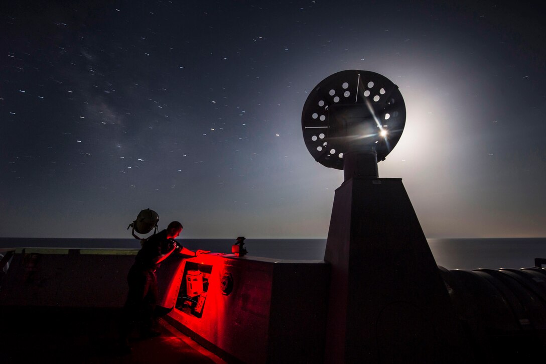 Navy Seaman James Keller checks weather information aboard the USS San Antonio in the Mediterranean Sea, July 12, 2016. The amphibious transport dock ship is supporting maritime security operations and theater security cooperation efforts in the U.S. 6th Fleet area of operations. Navy photo by Petty Officer 2nd Class Adam Austin