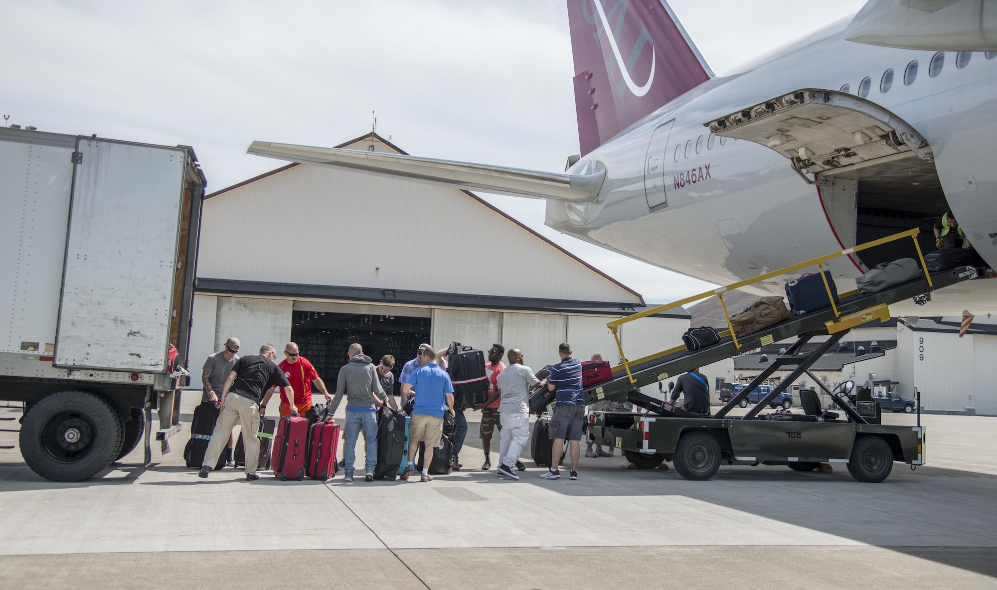 U.S. Air Force Airmen load luggage onto a Boeing 757 at Misawa Air Base, Japan, July 11, 2016. Airmen loaded cargo for the mass movement of approximately 250 Airmen from the 35th Fighter Wing to Pangkalan Udara Butterworth and Pangkalan Udara Subang, Malaysia, to take part in exercise Cope Taufan 16. This large force employment exercise will include operations in air superiority, airborne command and control, close air support, interdiction, air refueling, tactical airlift and tactical air drop. (U.S. Air Force photo by Senior Airman Brittany A. Chase)