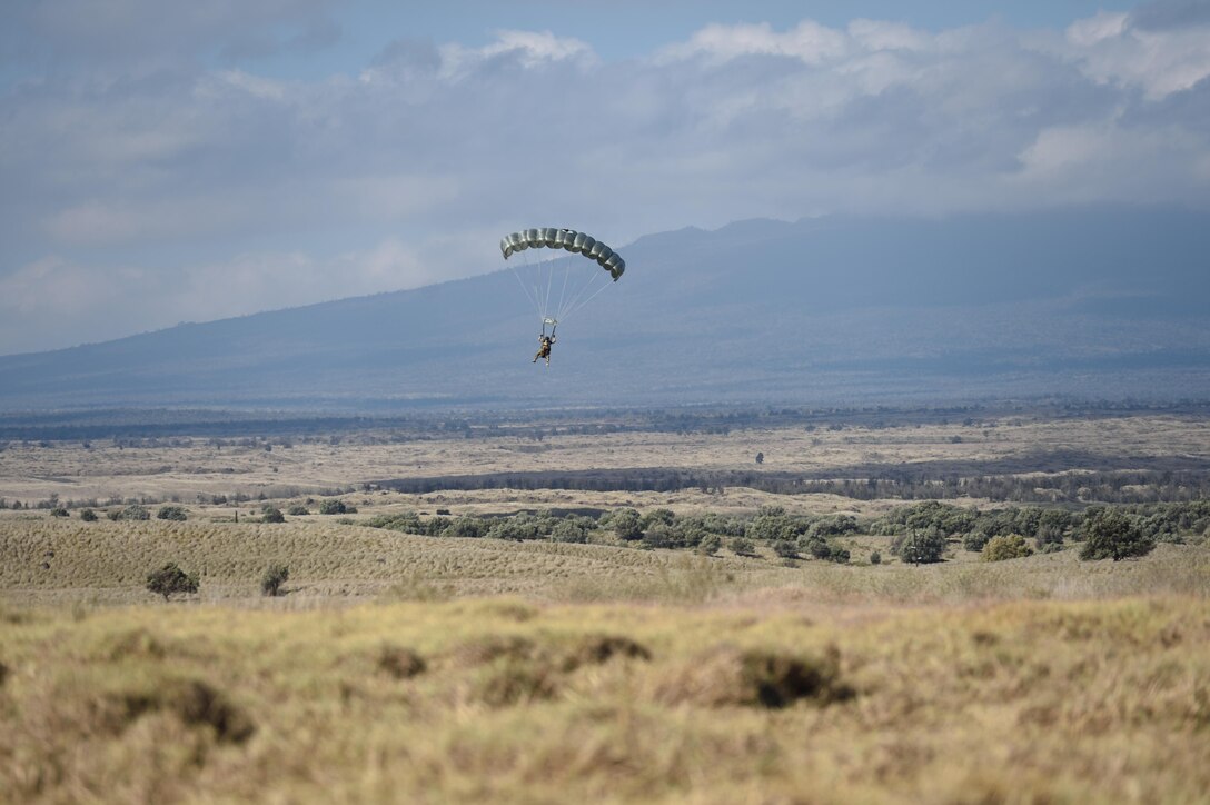 160709-F-DF491-215 POHAKULOA TRAINING AREA, Hawaii (July 9, 2016) – A Special Tactics Airman with the 320th Special Tactics Squadron performs a high-altitude, low-opening jump to infiltrate into a simulated disaster area during a humanitarian assistance and disaster response scenario as part of Rim of the Pacific 2016, at Pohakuloa Training Area, Hawaii, July 10, 2016. Twenty-six nations, more than 40 ships and submarines, more than 200 aircraft and 25,000 personnel are participating in RIMPAC from June 30 to Aug. 4, in and around the Hawaiian Islands and Southern California. The world's largest international maritime exercise, RIMPAC provides a unique training opportunity that helps participants foster and sustain the cooperative relationships that are critical to ensuring the safety of sea lanes and security on the world's oceans. RIMPAC 2016 is the 25th exercise in the series that began in 1971.(U.S. Air Force photo by 2nd Lt. Jaclyn Pienkowski)