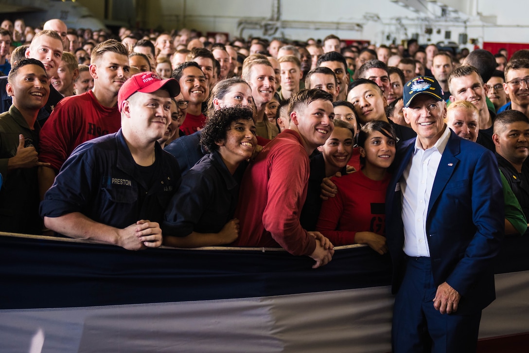 Vice President Joe Biden poses for a photo with sailors in the hangar bay of the USS John C. Stennis during the 2016 Rim of the Pacific exercise in the Pacific Ocean, July 14, 2016. Navy photo by Petty Officer 3rd Class Luke Moyer