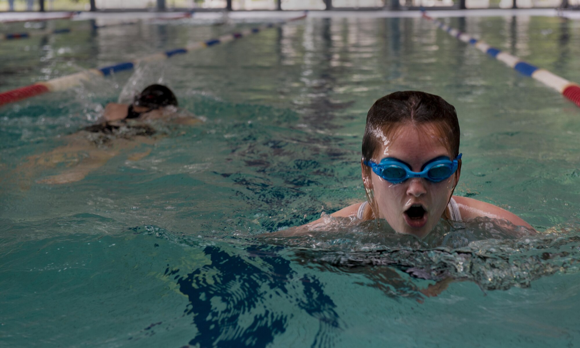 A student in the Ramstein Aquatic Center Lifeguard Course swims as a prerequisite for the course July 11, 2016, at Ramstein Air Base, Germany. If a student struggles with the prerequisites, they are encouraged to take the time until the next course starts to practice and strengthen their swimming skills. (U.S. Air Force photo/Airman 1st Class Tryphena Mayhugh)