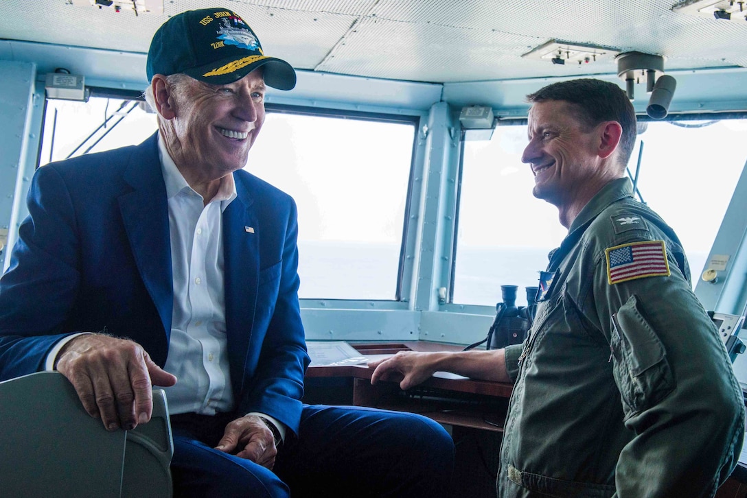 Vice President Joe Biden, left, meets with Navy Capt. Greg Huffman, commander of the USS John C. Stennis, on the ship's bridge during the 2016 Rim of the Pacific exercise in the Pacific Ocean, July 14, 2016. Navy photo by Petty Officer 3rd Class Luke Moyer