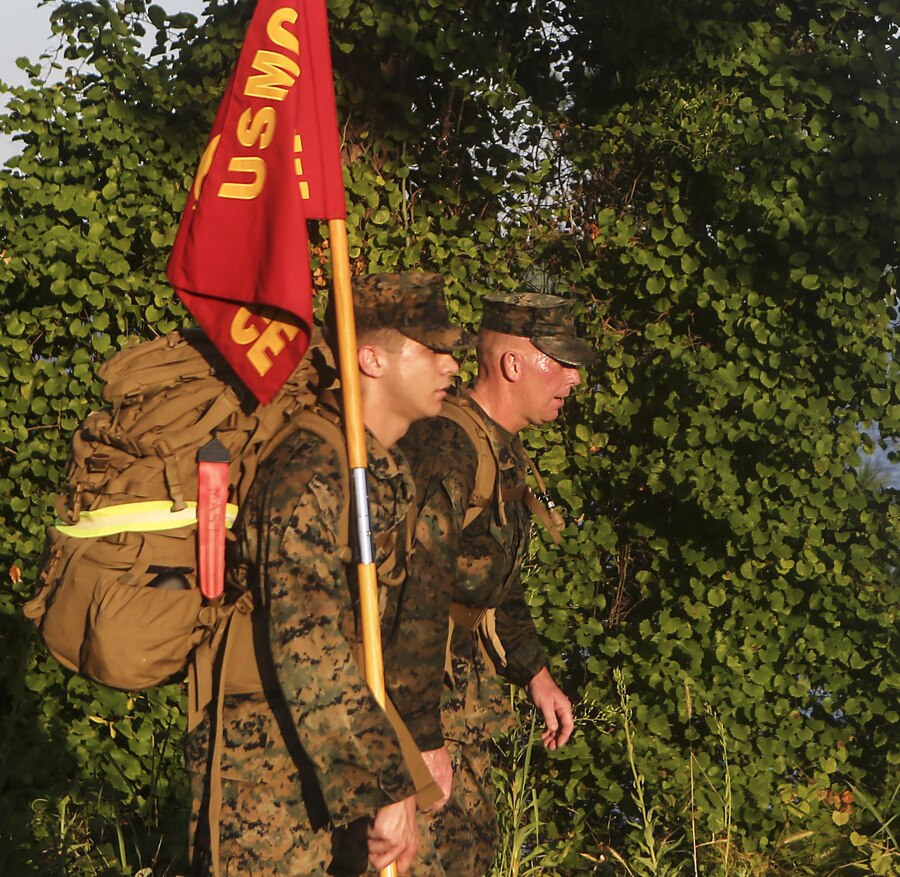 SgtMaj. Brett C. Scheuer, 26th Marine Expeditionary Unit, leads his Marines and Sailors on a conditioning hike aboard Marine Corps Base Camp Lejeune, July 15. The hike was completed by the staff noncommissioned officers and noncommissioned officers within the unit and was designed to build camaraderie and improve unit cohesion. (U.S. Marine Corps photo by GySgt. Andrew Pendracki/Released) 