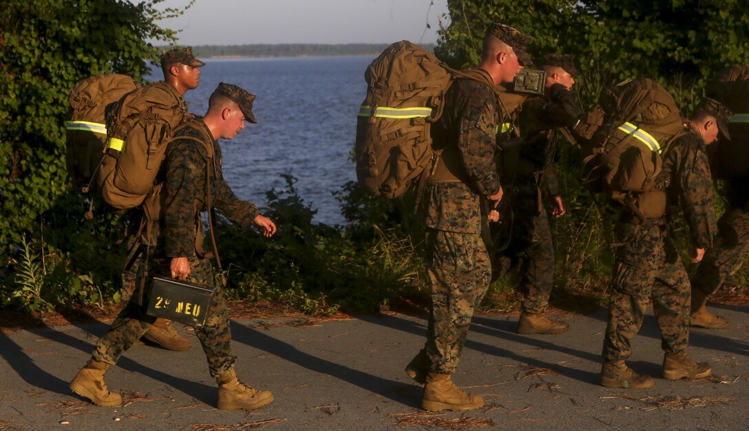 Marines and Sailors with the 26th Marine Expeditionary Unit conduct a conditioning hike aboard Marine Corps Base Camp Lejeune, July 15. The hike was completed by the staff noncommissioned officers and noncommissioned officers within the unit and was designed to build camaraderie and improve unit cohesion. (U.S. Marine Corps photo by GySgt. Andrew Pendracki/Released) 