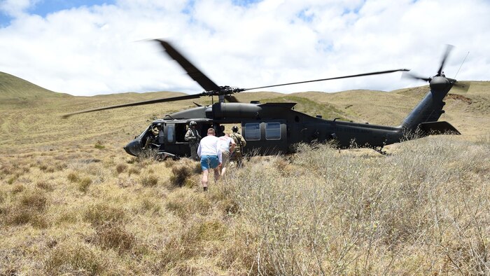 A pararescueman with the 320th Special Tactics Squadron escorts two simulated earthquake survivors to be evacuated from the area to safety in a UH-60 Blackhawk during a humanitarian assistance and disaster response scenario as part of Rim of the Pacific 2016, at Pohakuloa Training Area, Hawaii, July 10, 2016. RIMPAC offers the 320th Special Tactics and III Marine Expeditionary Force an opportunity to team up and practice their unique skills to strengthen their partnership in order to respond to crises quickly. Twenty-six nations, more than 40 ships and submarines, more than 200 aircraft and 25,000 personnel are participating in RIMPAC from June 30 to Aug. 4, in and around the Hawaiian Islands and Southern California. The world's largest international maritime exercise, RIMPAC provides a unique training opportunity that helps participants foster and sustain the cooperative relationships that are critical to ensuring the safety of sea lanes and security on the world's oceans. RIMPAC 2016 is the 25th exercise in the series that began in 1971.