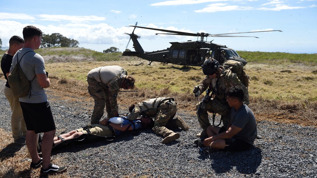 Special Tactics Airmen from the 320th Special Tactics Squadron prepare to load simulated injured civilians on the UH-60 Blackhawk during a humanitarian assistance and disaster response scenario as part of Rim of the Pacific 2016, at Pohakuloa Training Area, Hawaii, July 10, 2016. Twenty-six nations, more than 40 ships and submarines, more than 200 aircraft and 25,000 personnel are participating in RIMPAC from June 30 to Aug. 4, in and around the Hawaiian Islands and Southern California. The world's largest international maritime exercise, RIMPAC provides a unique training opportunity that helps participants foster and sustain the cooperative relationships that are critical to ensuring the safety of sea lanes and security on the world's oceans. RIMPAC 2016 is the 25th exercise in the series that began in 1971.