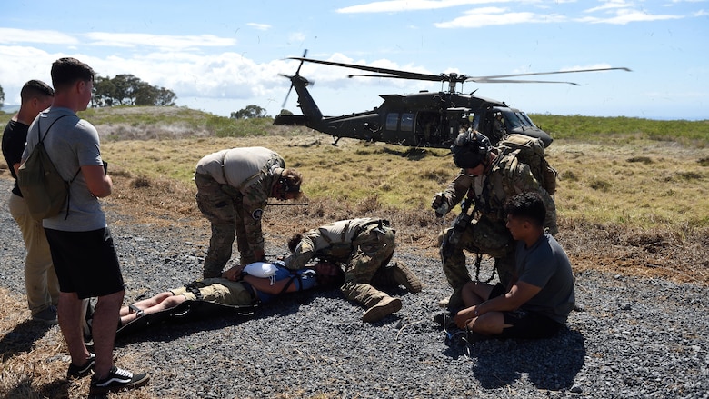 Special Tactics Airmen from the 320th Special Tactics Squadron prepare to load simulated injured civilians on the UH-60 Blackhawk during a humanitarian assistance and disaster response scenario as part of Rim of the Pacific 2016, at Pohakuloa Training Area, Hawaii, July 10, 2016. Twenty-six nations, more than 40 ships and submarines, more than 200 aircraft and 25,000 personnel are participating in RIMPAC from June 30 to Aug. 4, in and around the Hawaiian Islands and Southern California. The world's largest international maritime exercise, RIMPAC provides a unique training opportunity that helps participants foster and sustain the cooperative relationships that are critical to ensuring the safety of sea lanes and security on the world's oceans. RIMPAC 2016 is the 25th exercise in the series that began in 1971.