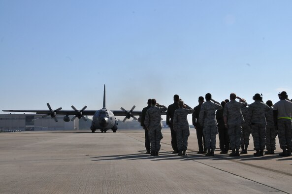A formation of 440th Airlift Wing Airmen saw the unit's final C-130 Hercules aircraft taxi and depart from Pope Army Airfield, N.C., June 29, 2016, signaling a major step in the unit's activation process. "This is the last flight for the 440th," said Col. Karl Schmitkons, the 440th Airlift Wing commander. "This airplane, when it leaves here, is the end of the legacy for the 440th here at Pope.” (U.S. Air Force photo by Maj. Lisa Ray)