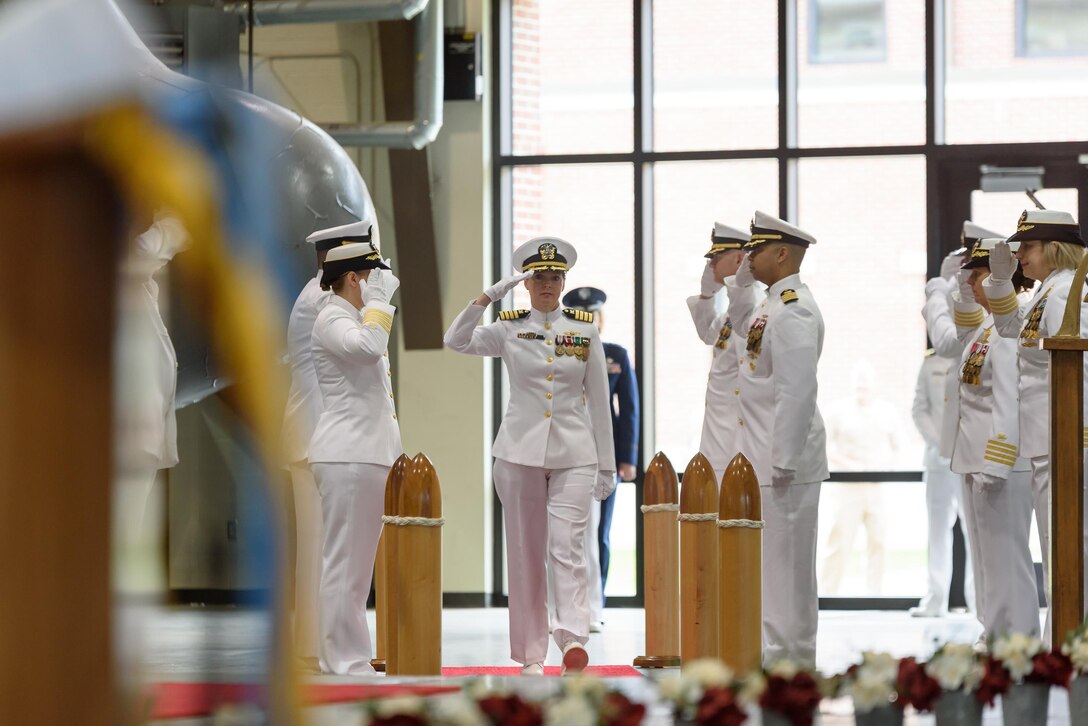 Navy Capt. Sonya Ebright passes through the sideboys at the start of Defense Contract Management Agency International's change of command ceremony at Fort Lee, Virginia, May 23. Ebright assumed command from Navy Rear Adm. Deborah Haven who had presided over the agency's international contract administration operations in 26 different countries overseeing 9,600 contracts totaling over $75 billion in program value.