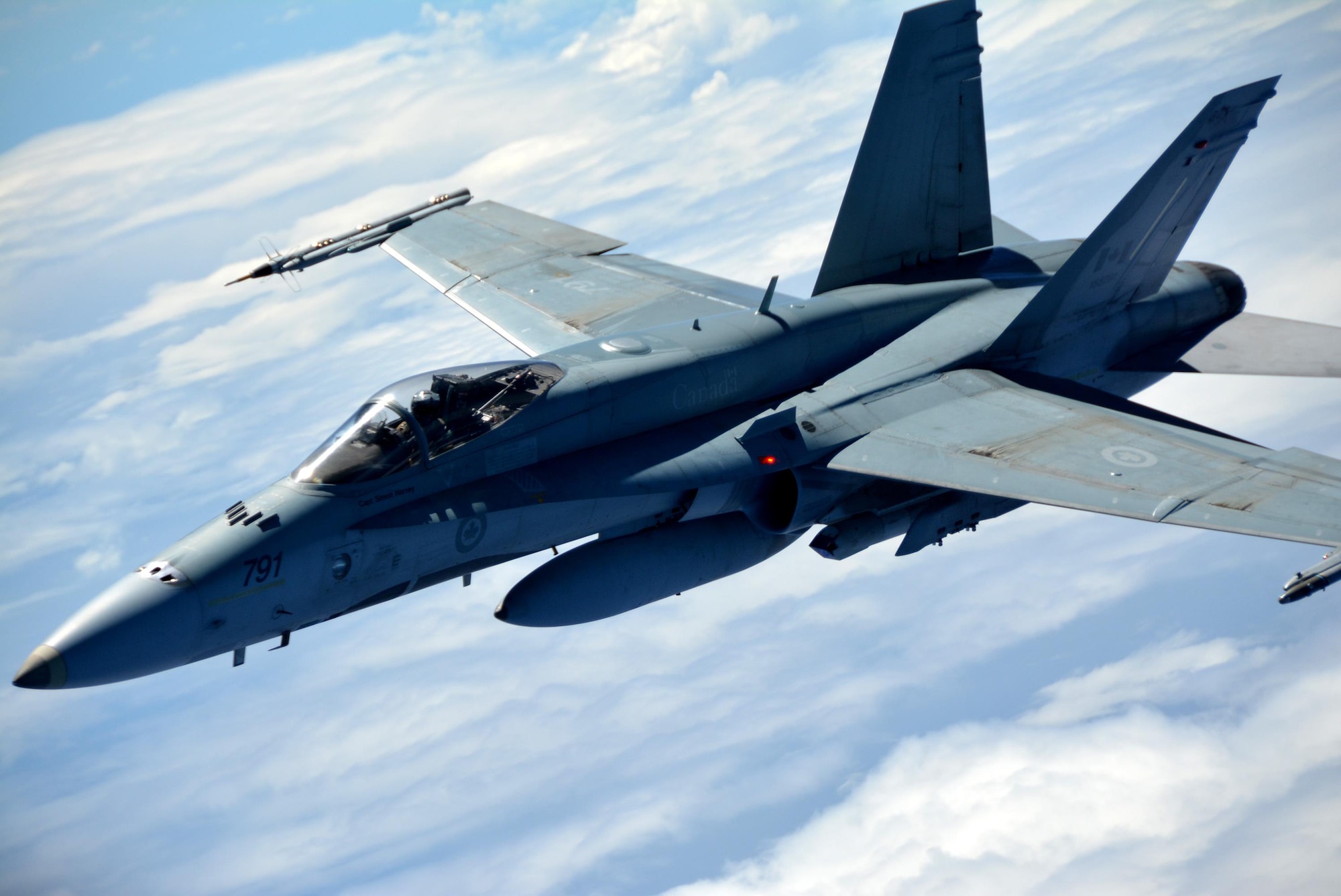 JOINT BASE PEARL HARBOR-HICKAM (July 11, 2016) A Royal Canadian Air Force CF-18 Hornet flies alongside a KC-135 Stratotanker flown by a crew from the 465th Air Refueling Squadron, Tinker Air Force Base, Okla., in support of Rim of the Pacific 2016. Twenty-six nations, more than 40 ships and submarines, more than 200 aircraft and 25,000 personnel are participating in RIMPAC from June 30 to Aug. 4, in and around the Hawaiian Islands and Southern California. The world's largest international maritime exercise, RIMPAC provides a unique training opportunity that helps participants foster and sustain the cooperative relationships that are critical to ensuring the safety of sea lanes and security on the world's oceans. RIMPAC 2016 is the 25th exercise in the series that began in 1971. (U.S. Air Force photo/Master Sgt. Grady Epperly)