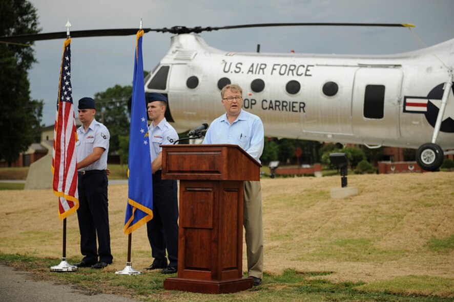 Mark Wilderman, 314th Airlift Wing historian, explains the heritage of the H-21B to a group of Airmen and civic leaders July 14, 2016, at Little Rock Air Force Base, Ark. The H-21B is the newest static display aircraft to enter into the Little Rock AFB fleet at Heritage Park. (U.S. Air Force photo/Senior Airman Harry Brexel)