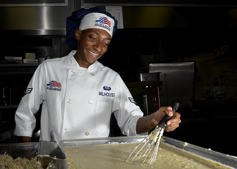 Airman 1st Class Juwan Milhouse, 48th Force Support Squadron food services journeyman, prepares food at the Knight’s Table dining facility on Royal Air Force Lakenheath, England, July, 12. Milhouse is the recipient of the Arthur J. Myers award, an Air Force-level award for military hospitality working toward the overall improvement of the quality of life for personnel. (U.S. Air Force photo/Senior Airman Nigel Sandridge/Released) 