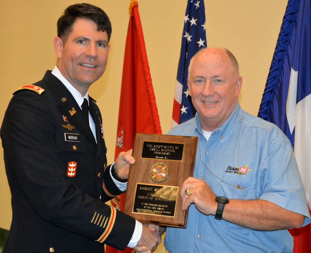 Robert P. Morris Jr., Program Manager, Small Business and Deputy Chief, Program and Project Management Division receives Small Business Program Manager of the Year for 2015 award during Forth Worth District Engineer Day Annual Awards Ceremony, June 14 from Lt. Col. Clay Morgan deputy commander, Fort Worth District.