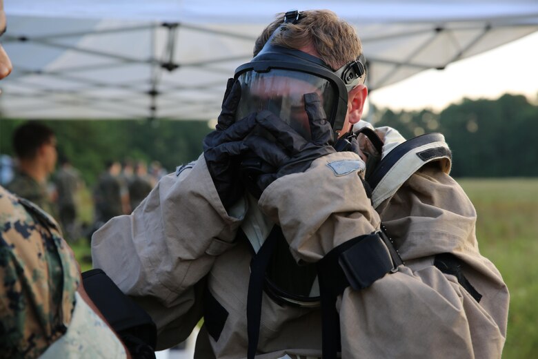 Lance Cpl. Ryan Shriver dons his gas mask during a training exercise at Marine Corps Air Station Cherry Point, N.C., July 12, 2016. The purpose of the training was to further refine the interoperability between MCAS Cherry Point’s Explosive Ordnance Disposal and 2nd Marine Aircraft Wing’s Chemical, Biological, Radiological and Nuclear Defense. Shriver is a CBRN defense specialist with Marine Wing Headquarters Squadron 2. (U.S. Marine Corps photo by Lance Cpl. Mackenzie Gibson/Released)