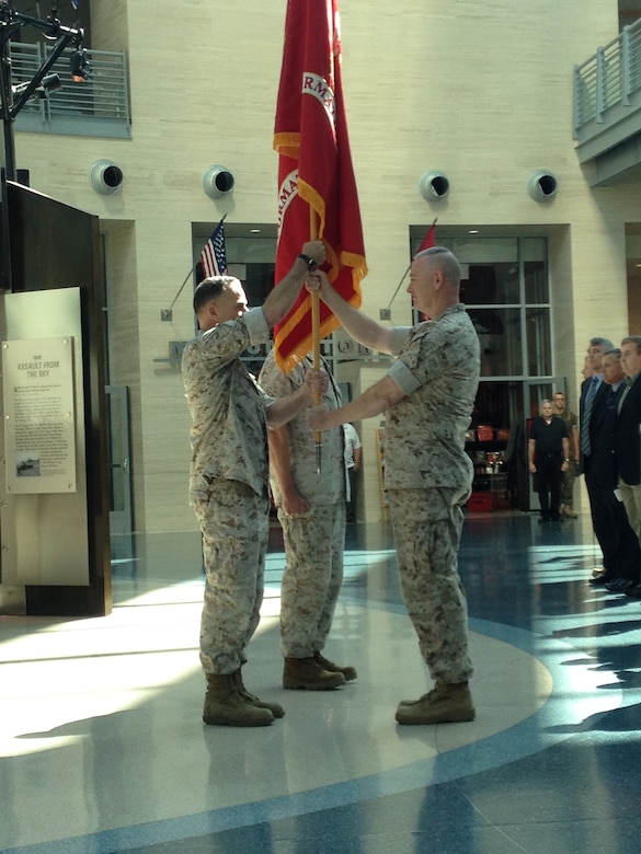 Colonel William (Beau) McClane assumes command of Marine Corps Information Operations Center (MCIOC) from Colonel Drew Cukor in the exchange of the banner during the ceremony officiating the transfer of command.