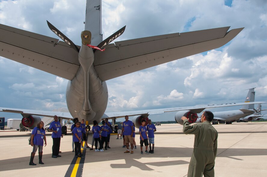 Staff Sgt. Mike Temal, 756th Air Refueling Squadron boom operator, illustrates the estimated distance an airplane is from the boom arm of a KC-135R Stratotanker while being refueled to a group of Southern Maryland Aviation & Career Camp students on the joint Base Andrews, Md., flight line July 13, 2016. More than a dozen students from the camp came out to learn about missions with the 459th to include those of pilots, boom operators and flight nurses. (U.S. Air Force photo/Staff Sgt. Kat Justen)
