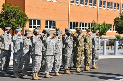 Soldiers from Headquarters and Headquarters Company, 63rd Regional Support Command, salute during the playing of the national anthem before the HHC change of command ceremony, July 13, Armed Forces Reserve Center, Mountain View, Calif.