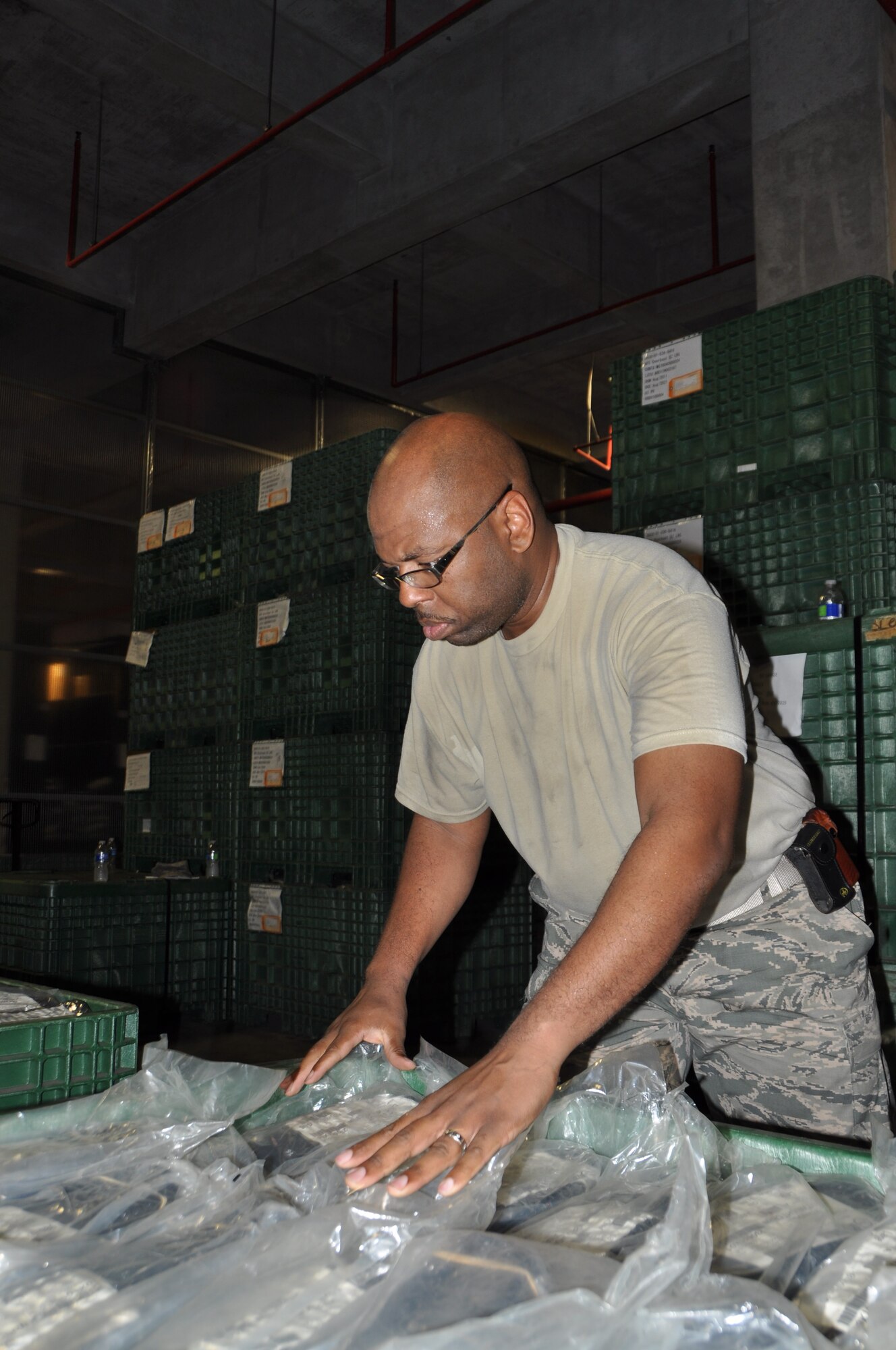 Staff Sgt. Tyran Lawson, 944th Logistics Readiness Squadron supply section, helps inventory individual protective equipment items June 28, 2016 during Operation Patriot Habu at Kadena Air Base, Okinawa. By the second day of the tour, Citizen Airmen from the 944th LRS helped process more than 3,000 IPE items. They provided extra manpower to their active-duty counterparts with the 18th Logistics Readiness Squadron, who are currently working 12-hour shifts to transition to the Enterprise Supply System which will eventually enable the 18th Wing to issue real-world IPE to its Airmen. 