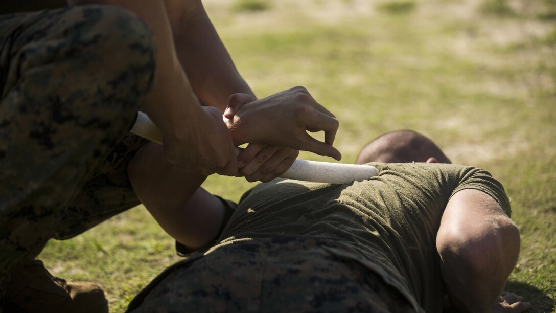 Marines with 3rd Battalion, 2nd Marine Regiment practice take-downs during a non-lethal weapons course at Marine Corps Base Camp Lejeune, N.C., July 15, 2016. Throughout the course they learned about various take-down techniques utilizing a police baton, riot control formations and tactics as well as the function and result of using a taser.  