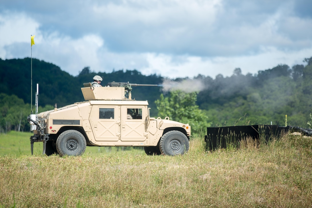 U.S. Army Spc. Joseph Robins, 368th Financial Management Support Unit, 329th Combat Sustainment Support Battalion, fires an M2 Browning, .50 Caliber Machine Gun on a High Mobility Multipurpose Wheeled Vehicles (HMMWV) at a live fire exercise during Warrior Exercise (WAREX) 86-16-03 at Fort McCoy, Wis., July 14, 2016. WAREX is designed to keep soldiers all across the United States ready to deploy. (U.S. Army photo by Spc. John Russell/Released)