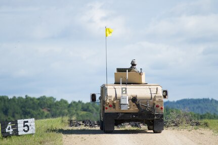 U.S. Army Spc. Joseph Robbins, 368th Financial Management Support Unit, 329th Combat Sustainment Support Battalion, scans the horizons with his M2 .50 Caliber Machine Gun for pop-up targets as part of a High Mobility Multipurpose Wheeled Vehicle (HMMWV) live fire event during Warrior Exercise (WAREX) 86-16-03 at Fort McCoy, Wis., July 14, 2016. WAREX is designed to keep soldiers all across the United States ready to deploy. (U.S. Army photo by Spc. Cody Hein/Released)