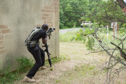 U.S. Army Pfc. Kokou Ledi, 222nd Battalion, 1st Brigade Combat Team, 10th Mountain Division, engages a High Mobility Multipurpose Wheeled Vehicle (HMMWV) while acting as a notional opposing force (OPFOR) during Warrior Exercise (WAREX) 86-16-03 at Fort McCoy, Wis., July 14, 2016. WAREX is designed to keep soldiers all across the United States ready to deploy. (U.S. Army photo by Spc. Cody Hein/Released)