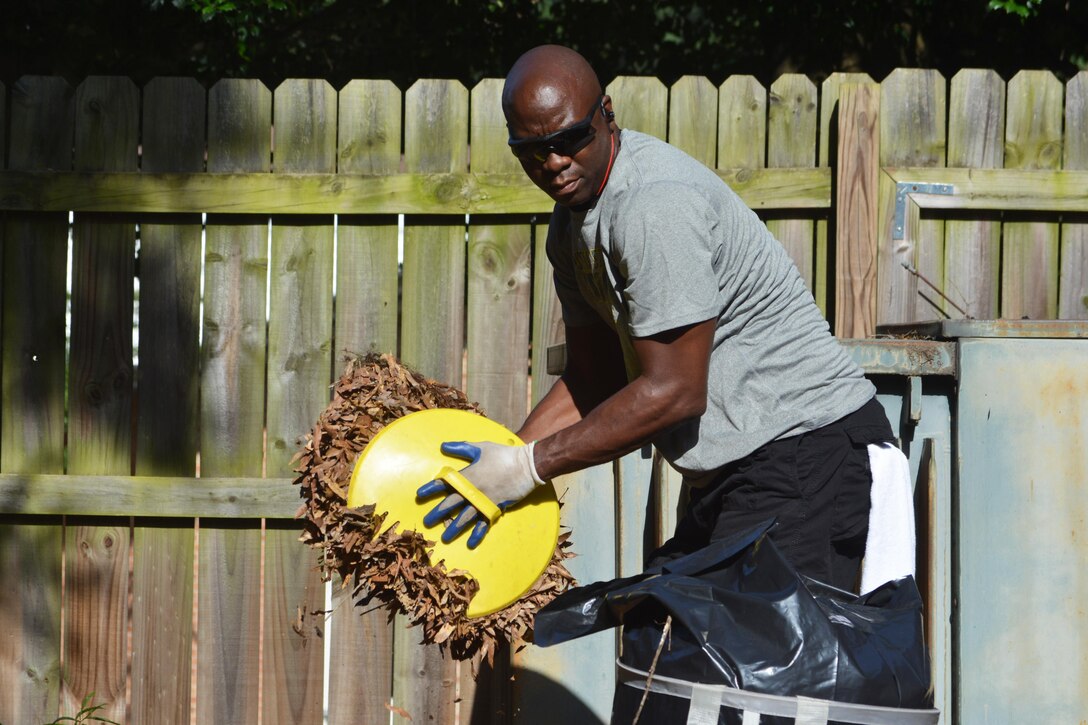 William A. Downey, the 80th Training Command’s Sexual Harassment/Assault Response & Prevention Program Manager removes leaves and other debris from the grounds of the headquarters building, Richmond, Va., July 14, 2016. Realizing that the contractors responsible for maintaining the grounds of the 80th Training Command headquarters were only responsible for cutting the grass, Soldiers and civilians assigned to the headquarters, decided to do something about it.  
They fought insects in 90 degree plus temperature for three days cleaning up debris and unsightly weeds around the building. “The Soldiers and civilians got back to the basics of policing their area,” said Michael Bland, the 80th TC’s chief executive officer. “In the current military environment, we have come to rely too much on contractors to handle that type of work.”