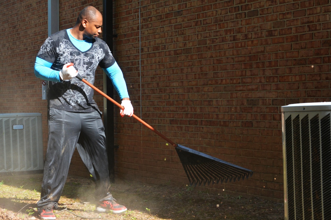 Master Sgt. Ramone Hardman, 80th Training Command headquarters, rakes leaves on the grounds of the command headquarters, Richmond, Va., July 14, 2016. Realizing that the contractors responsible for maintaining the grounds of the 80th Training Command headquarters were only responsible for cutting the grass, Soldiers and civilians assigned to the headquarters, decided to do something about it.  
They fought insects in 90 degree plus temperature for three days cleaning up debris and unsightly weeds around the building. 
“The Soldiers and civilians got back to the basics of policing their area,” said Michael Bland, the 80th TC’s chief executive officer. “In the current military environment, we have come to rely too much on contractors to handle that type of work.”