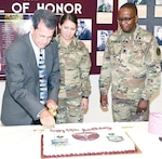 (From left) Retired Col. Greg Griffin, 2nd Lt. Hannah Martinez, and Lt. Col. Marion Jefferson cut the ceremonial cake at June 30 at the U.S. Army Medical Department Museum at Fort Sam Houston., celebrating 99 years of the Medial Service Corps.