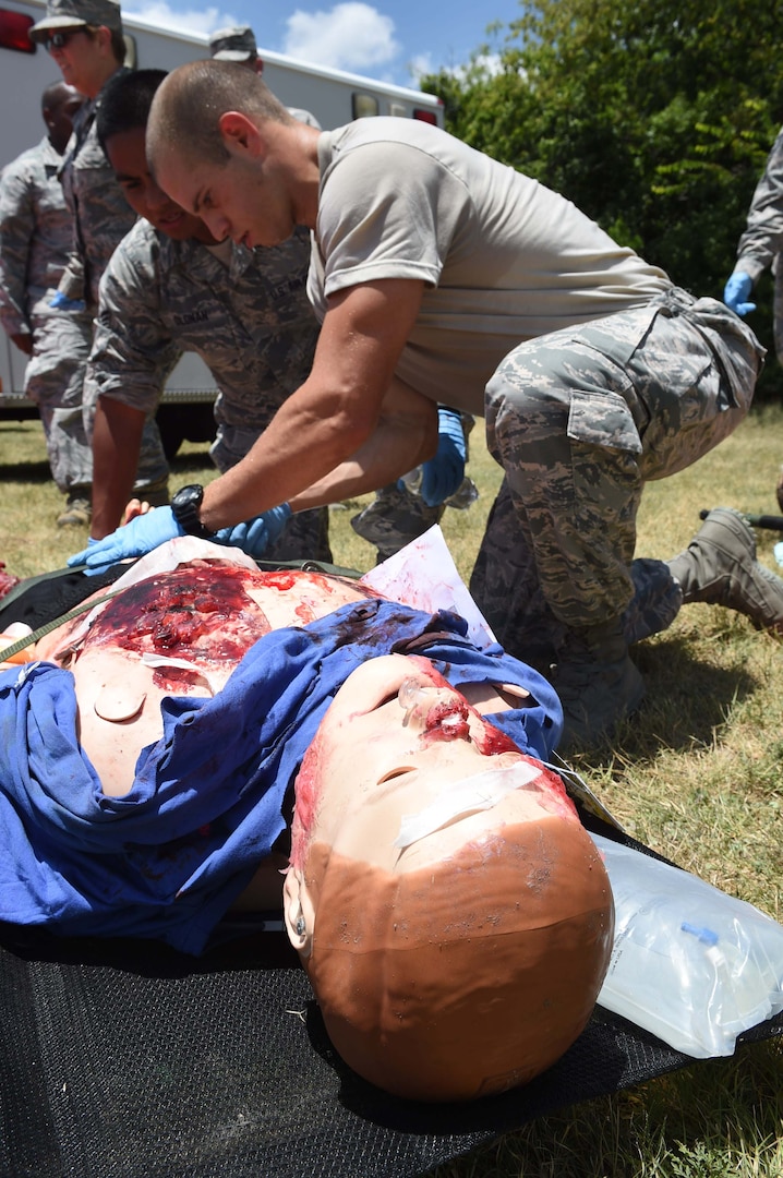 Medics from the 59th Medical Wing triage a patient during a disaster response exercise July 13, 2016 at Camp Bramble on Joint Base San Antonio-Lackland, Texas. The exercise simulated an aircraft crash designed to test the medics’ response skills in the event of a similar real-world incident. (U.S. Air Force photo/Staff Sgt. Jerilyn Quintanilla)