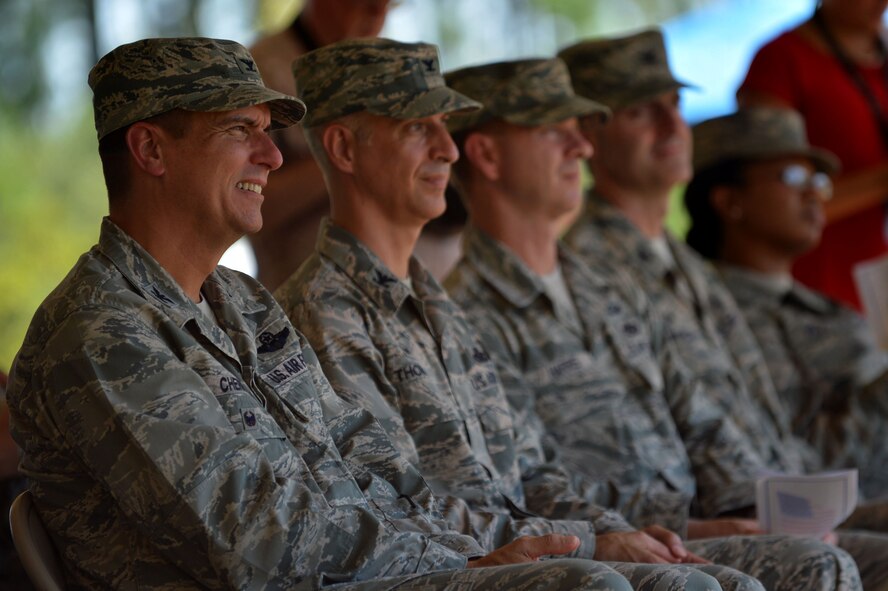 Members of Team Shaw and the community watch during the Ashley-Bowman Boulevard road naming ceremony near the Sumter Gate at Shaw Air Force Base, S.C., July 14, 2016. Shaw unveiled the new road name, Ashley-Bowman Boulevard during the ceremony, honoring two Tuskegee Airmen, Lt. Col. Willie Ashley and 1st Lt. Leroy Bowman, both Sumter, S.C., natives who served in the Army Air Corps during World War II. (U.S. Air Force photo by Senior Airman Michael Cossaboom)