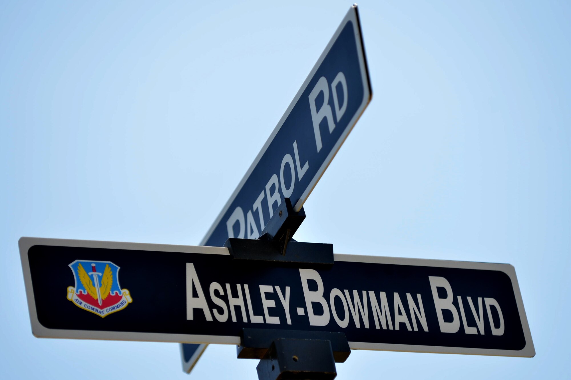 The Ashley-Bowman Boulevard sign is unveiled near the Sumter Gate after the road naming ceremony on Shaw Air Force Base, S.C., July 14, 2016. The road is named after Lt. Col. Willie Ashley and 1st Lt. Leroy Bowman, both Sumter, S.C. natives who served in the Army Air Corps as Tuskegee Airmen during World War II. (U.S. Air Force photo by Senior Airman Michael Cossaboom)