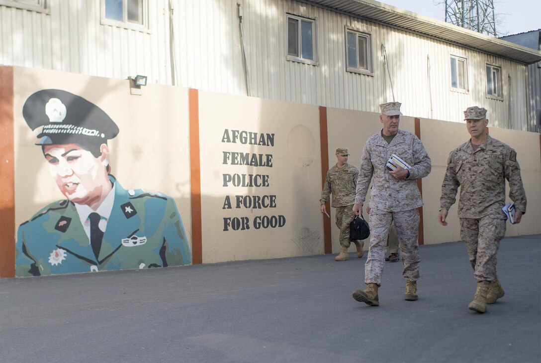 Marine Corps Gen. Joe Dunford, left, chairman of the Joint Chiefs of Staff, walks with his executive assistant in Kabul, Afghanistan, July 15, 2016. DoD photo by Navy Petty Officer 2nd Class Dominique A. Pineiro
