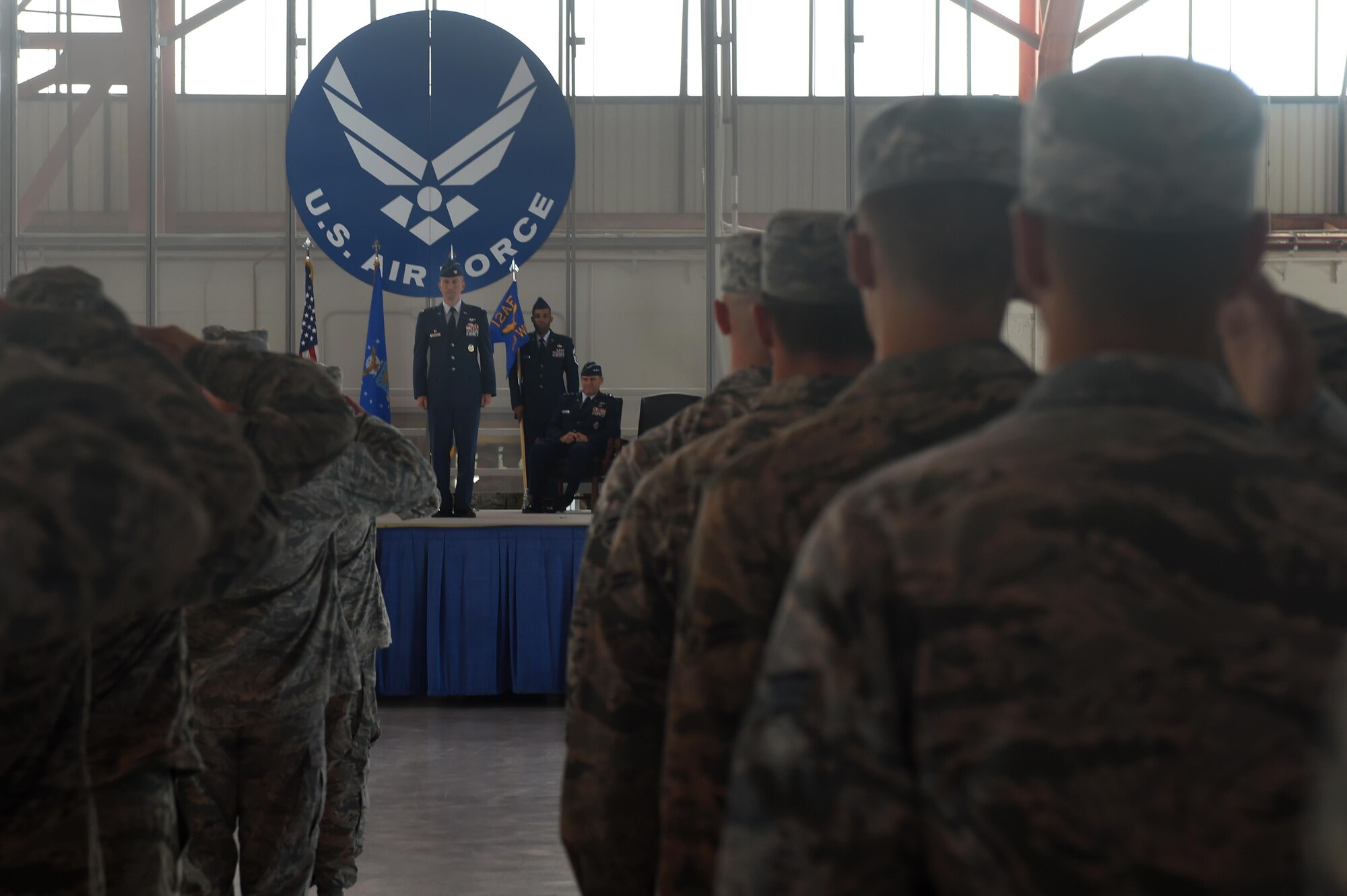 Col. Houston Cantwell, the 49th Wing commander, receives his first salute from members of the wing during a change of command ceremony at Holloman Air Force Base, N.M., on July 15. As commander of the 49th Wing, Cantwell is responsible for more than 17,000 military and civilian personnel. (Last names are being withheld due to operational requirements. U.S. Air Force photo by Staff Sgt. Eboni Prince)