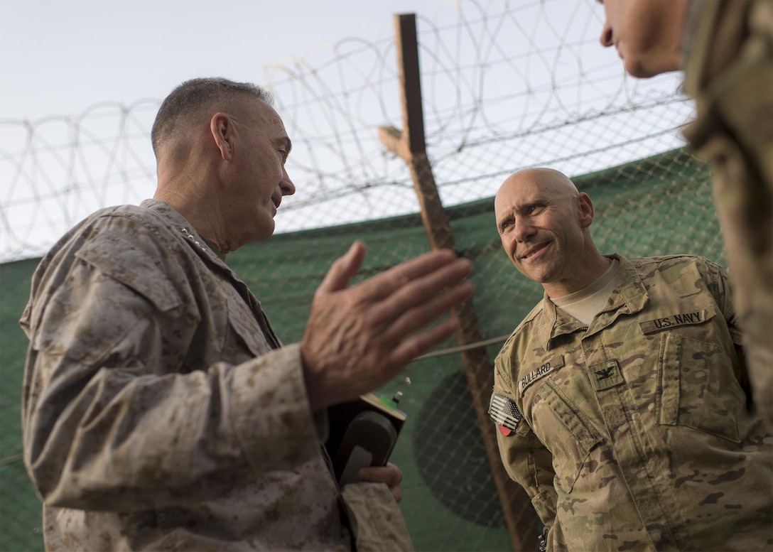 Marine Corps Gen. Joe Dunford Jr., left, chairman of the Joint Chiefs of Staff, talks with Navy Capt. Bullard, center, and other sailors in Kabul, Afghanistan, July 15, 2016. DoD photo by Navy Petty Officer 2nd Class Dominique A. Pineiro