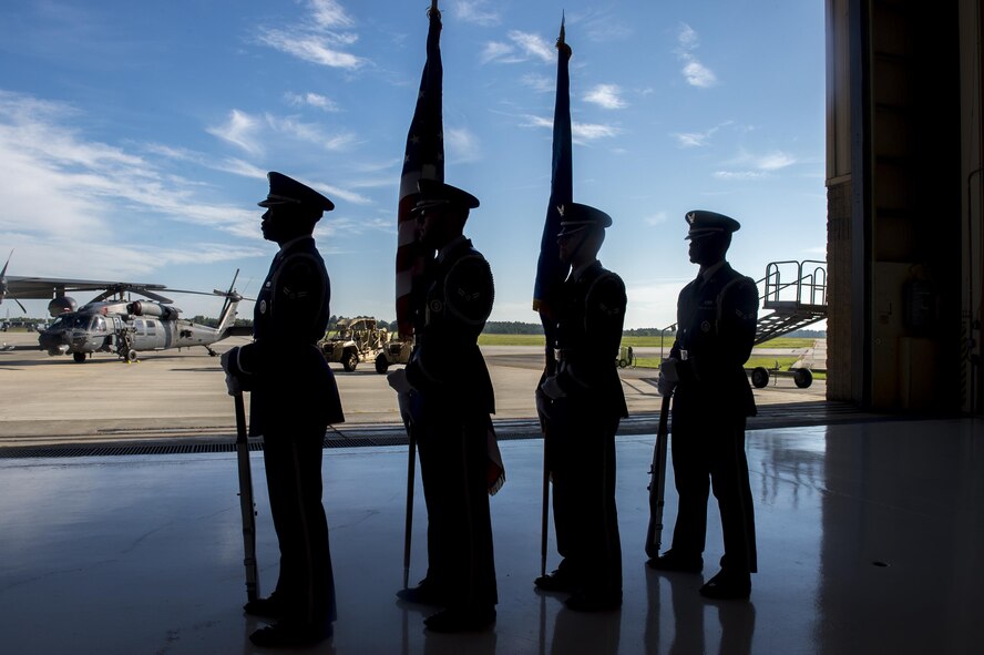 Members of the Moody Honor Guard prepare to present the colors during U.S. Air Force Chief Master Sgt. Maxie Gainey’s retirement ceremony, July 15, 2016, at Moody Air Force Base, Ga. Gainey was the chief enlisted manager for the 347th Rescue Group and has served in the U.S. Air Force for more than 30 years. (U.S. Air Force photo by Tech. Sgt. Zachary Wolf)
