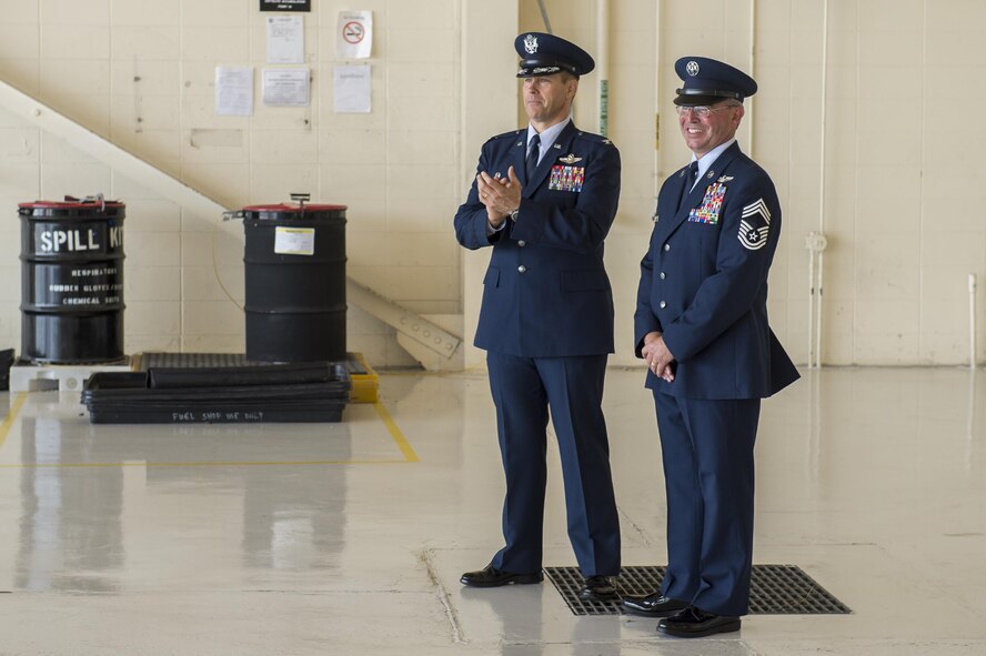 U.S. Air Force Col. Thomas Dorl, 347th Rescue Group commander, and Chief Master Sgt. Maxie Gainey, 347th RQG chief enlisted manager, prepare to take the stage during a retirement ceremony, July 15, 2016, at Moody Air Force Base, Ga. Gainey, as a chief enlisted manager, advised the commander with operational plans, policies and requirements affecting nearly 450 enlisted Airmen in four different squadrons. (U.S. Air Force photo by Tech. Sgt. Zachary Wolf)
