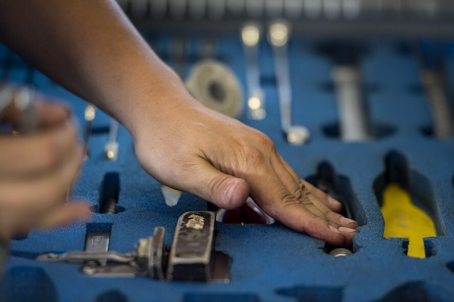 U.S. Air Force Senior Airman Elijah Cecil, 74th Aircraft Maintenance Unit load crew member, replaces tools in a toolbox during a weapons load competition, July 15, 2016, at Moody Air Force Base, Ga. In addition to the weapons load process, teams were also judged on their job knowledge and adherence to Technical Orders and safety procedures. (U.S. Air Force photo by Senior Airman Ryan Callaghan)