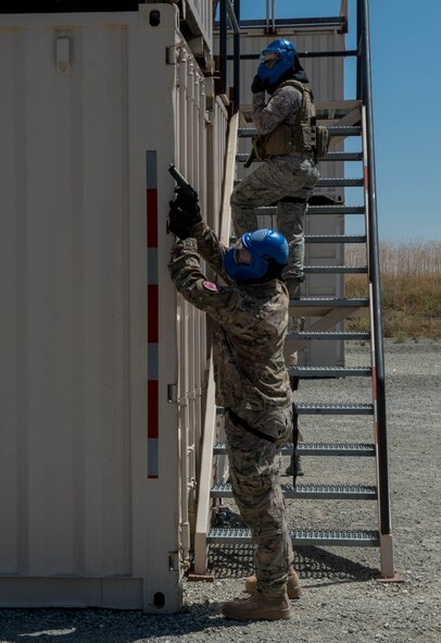 Defenders assigned to the 921st Contingency Response Squadron and the 821st CRS participate in urban close quarters combat training using simunition rounds June 30, 2016 at the Emergency Responder Urban Training Site at Travis Air Force Base, California. (U.S. Air Force photo by Staff Sgt. Robert Hicks)