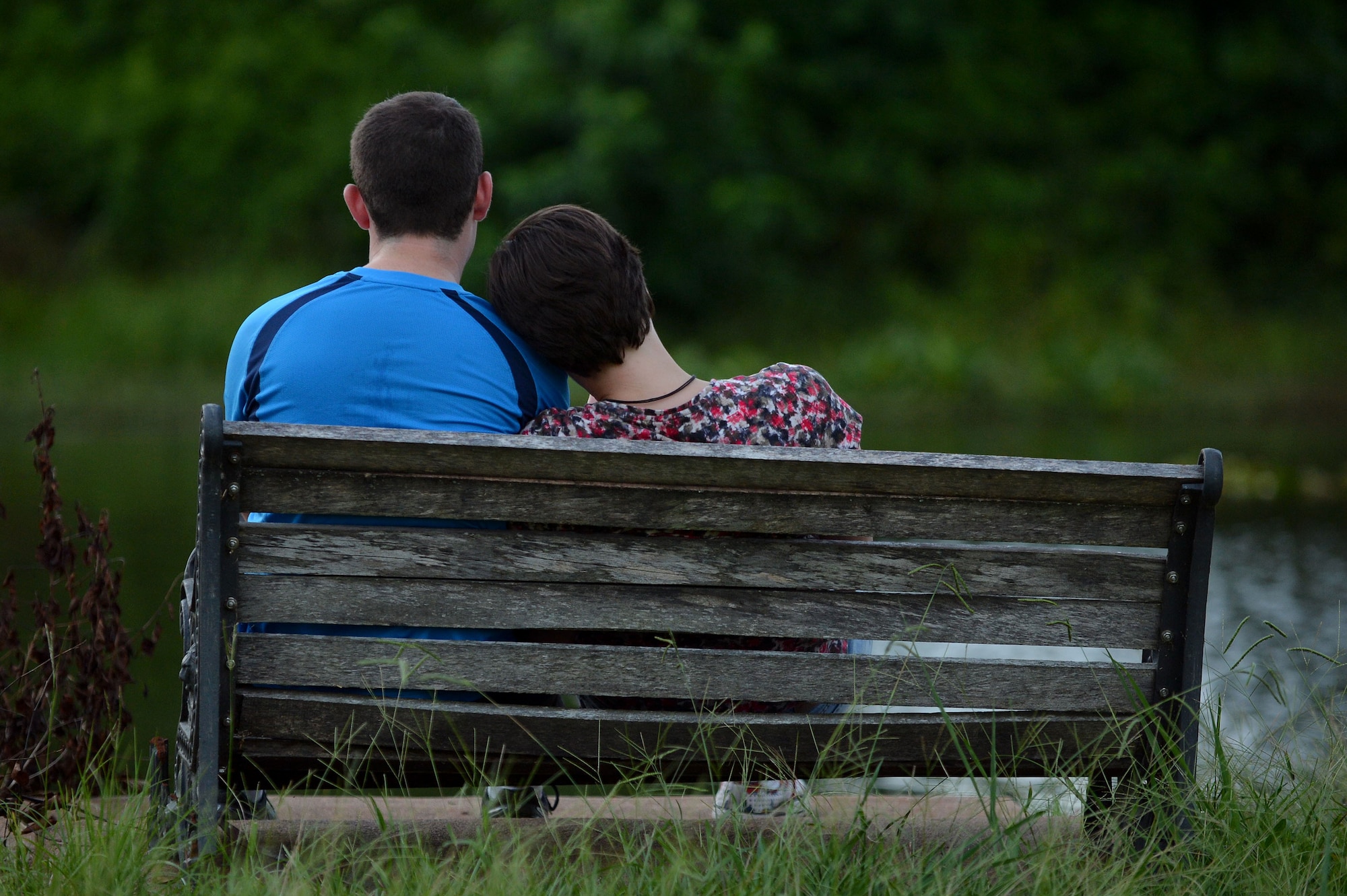 (From left) U.S. Air Force Airman 1st Class Mike Sullivan, 20th Communications Squadron knowledge management specialist, and Airman 1st Class Luria Staats, 20th CS client service technician, play the new game Pokémon Go at Memorial Lake on Shaw Air Force Base, S.C., July 12, 2016. Throughout the night at Memorial Lake, single service members, couples, and families of all ages and walks of life gathered at the lake to share in the fun of Pokémon Go and strive to achieve their childhood goal of becoming a Pokémon master. (U.S. Air Force photo by Senior Airman Michael Cossaboom)