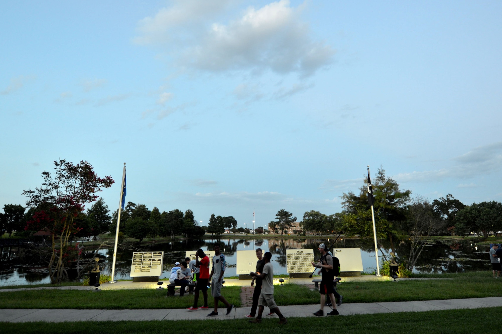 U.S. Air Force Airmen and U.S. Army Soldiers walk around Memorial Lake on Shaw Air Force Base, S.C., July 12, 2016. Shaw is a high operations tempo Air Force installation, housing not only the largest combat F-16CM Fighting Falcon wing in the Air Force, but Ninth Air Force, U.S. Air Forces Central Command, and U.S. Army Central Command. With such missions being carried out on base, Airmen and Soldiers are often pushed to their physical and mental limits on a daily basis. The new mobile game, Pokémon Go, has allowed Team Shaw members to get out more and interact with each other while boosting morale throughout the base. (U.S. Air Force photo by Senior Airman Michael Cossaboom)