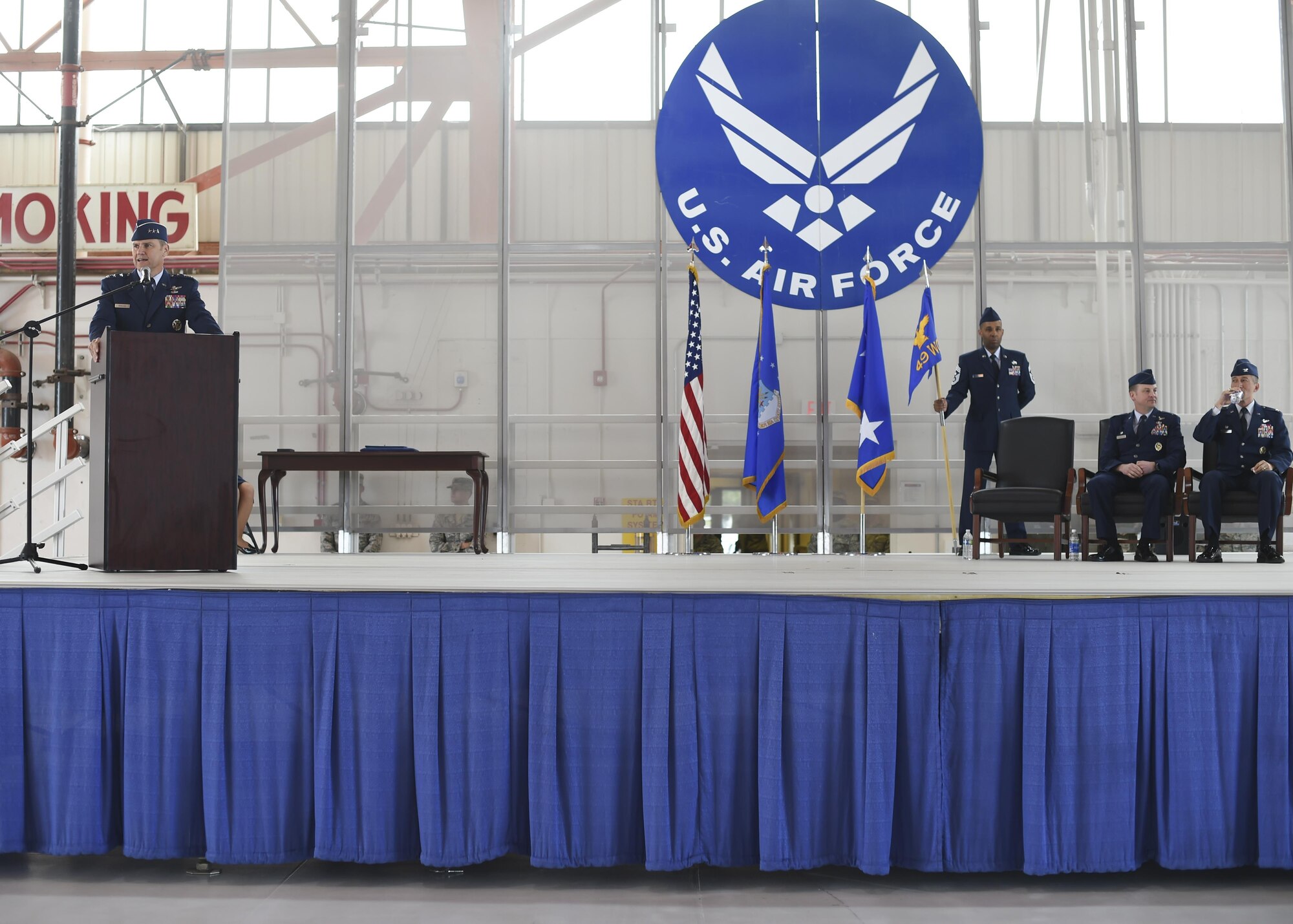 Lt. Gen. Mark Nowland the 12th Air Force commander delivers opening remarks before officiating the change-of-command ceremony July 15 at Hangar 500 at Holloman Air Force Base N.M. Col. Houston Cantwell assumed command of the 49th Wing and Holloman Air Force Base from the previous commander, Col. Robert Kiebler. As commander of the 49th Wing, Cantwell will lead Holloman’s mission to provide combat-ready Airmen, train MQ-1 Predator and MQ-9 Reaper pilots and sensor operators, and hosts the 54th Fighter Group's F-16 Fighting Falcon pilot training mission, the 96th Test Group's high-speed test track mission and the German Air Force Flying Training Center. (U.S. Air Force Photo by: Staff Sgt. Stacy Moless)