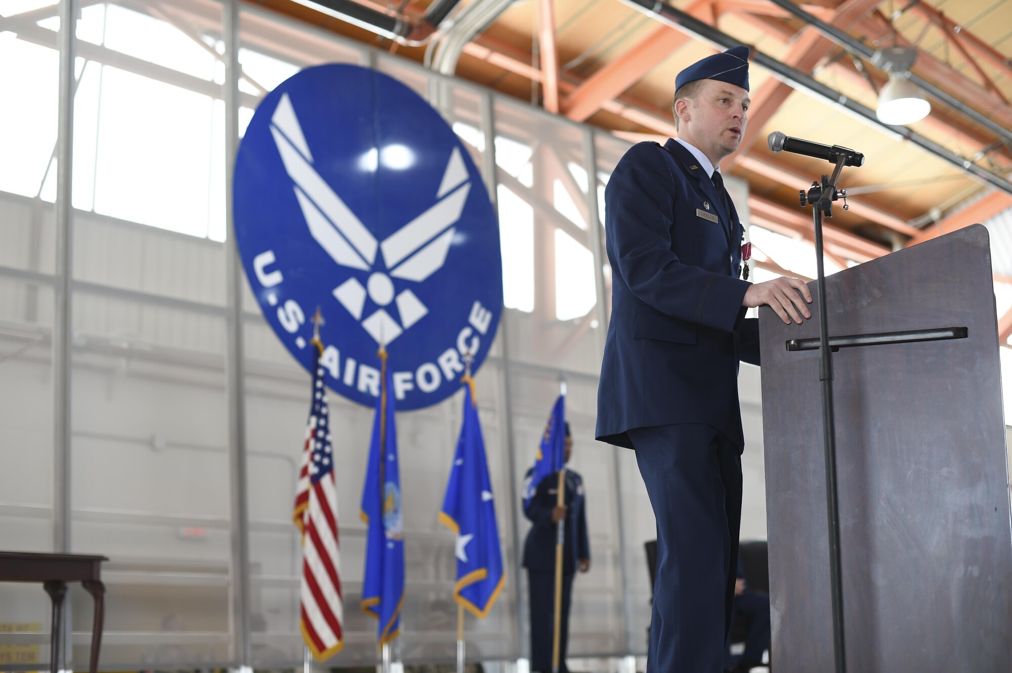 Col. Robert Kiebler delivers his final speech during a change-of-command ceremony July 15 at Hangar 500 at Holloman Air Force Base N.M. Col. Houston Cantwell assumed command of the 49th Wing and Holloman Air Force Base from the previous commander, Col. Robert Kiebler. As commander of the 49th Wing, Cantwell will lead Holloman’s mission to provide combat-ready Airmen, train MQ-1 Predator and MQ-9 Reaper pilots and sensor operators, and hosts the 54th Fighter Group's F-16 Fighting Falcon pilot training mission, the 96th Test Group's high-speed test track mission and the German Air Force Flying Training Center. (U.S. Air Force Photo by: Staff Sgt. Stacy Moless)