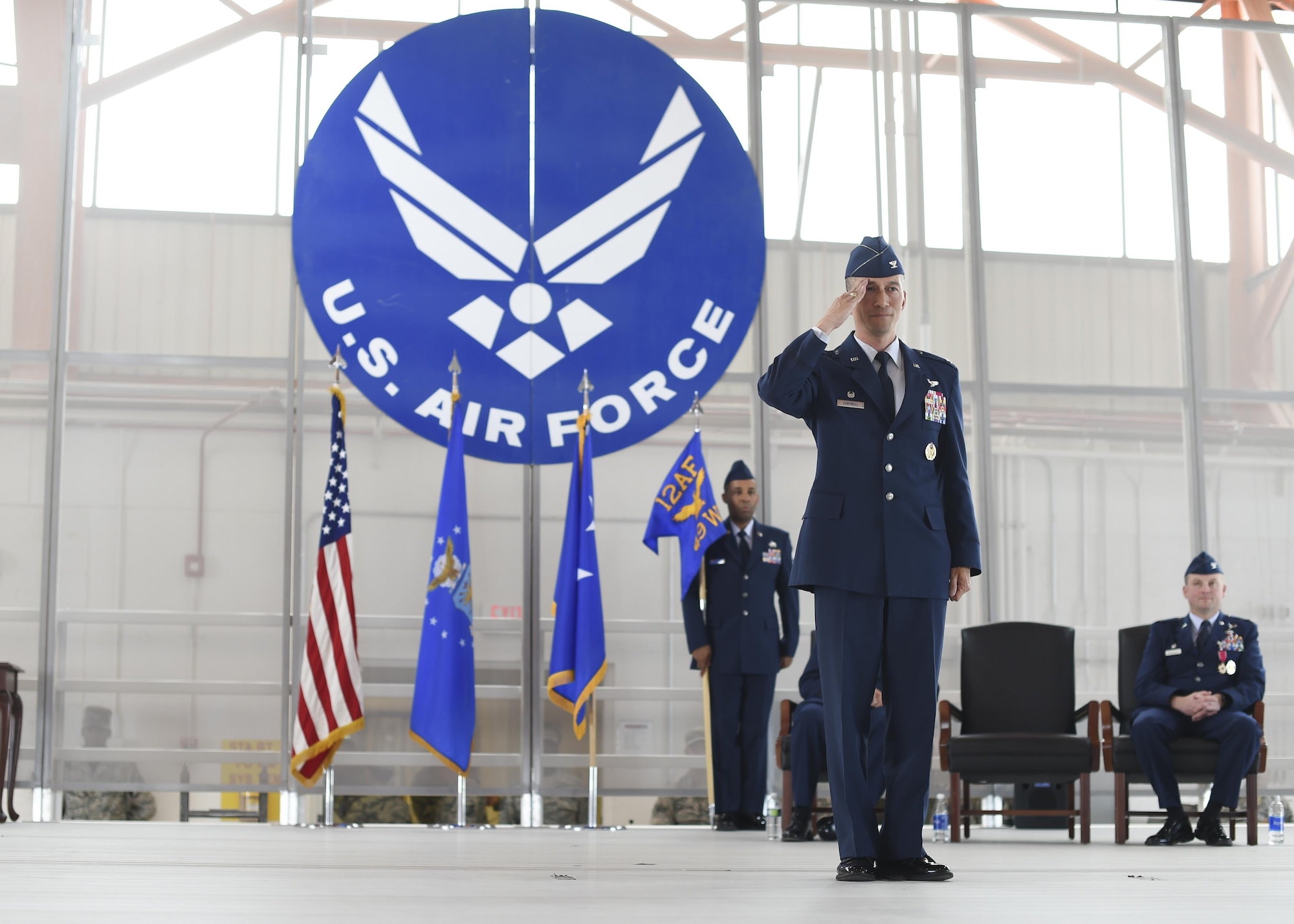 Col. Houston Cantwell, the 49th Wing commander renders his first salute as wing commander during a change-of-command ceremony July 15 at Hangar 500 at Holloman Air Force Base N.M. Col. Houston Cantwell assumed command of the 49th Wing and Holloman Air Force Base from the previous commander, Col. Robert Kiebler. As commander of the 49th Wing, Cantwell will lead Holloman’s mission to provide combat-ready Airmen, train MQ-1 Predator and MQ-9 Reaper pilots and sensor operators, and hosts the 54th Fighter Group's F-16 Fighting Falcon pilot training mission, the 96th Test Group's high-speed test track mission and the German Air Force Flying Training Center. (U.S. Air Force Photo by: Staff Sgt. Stacy Moless)
