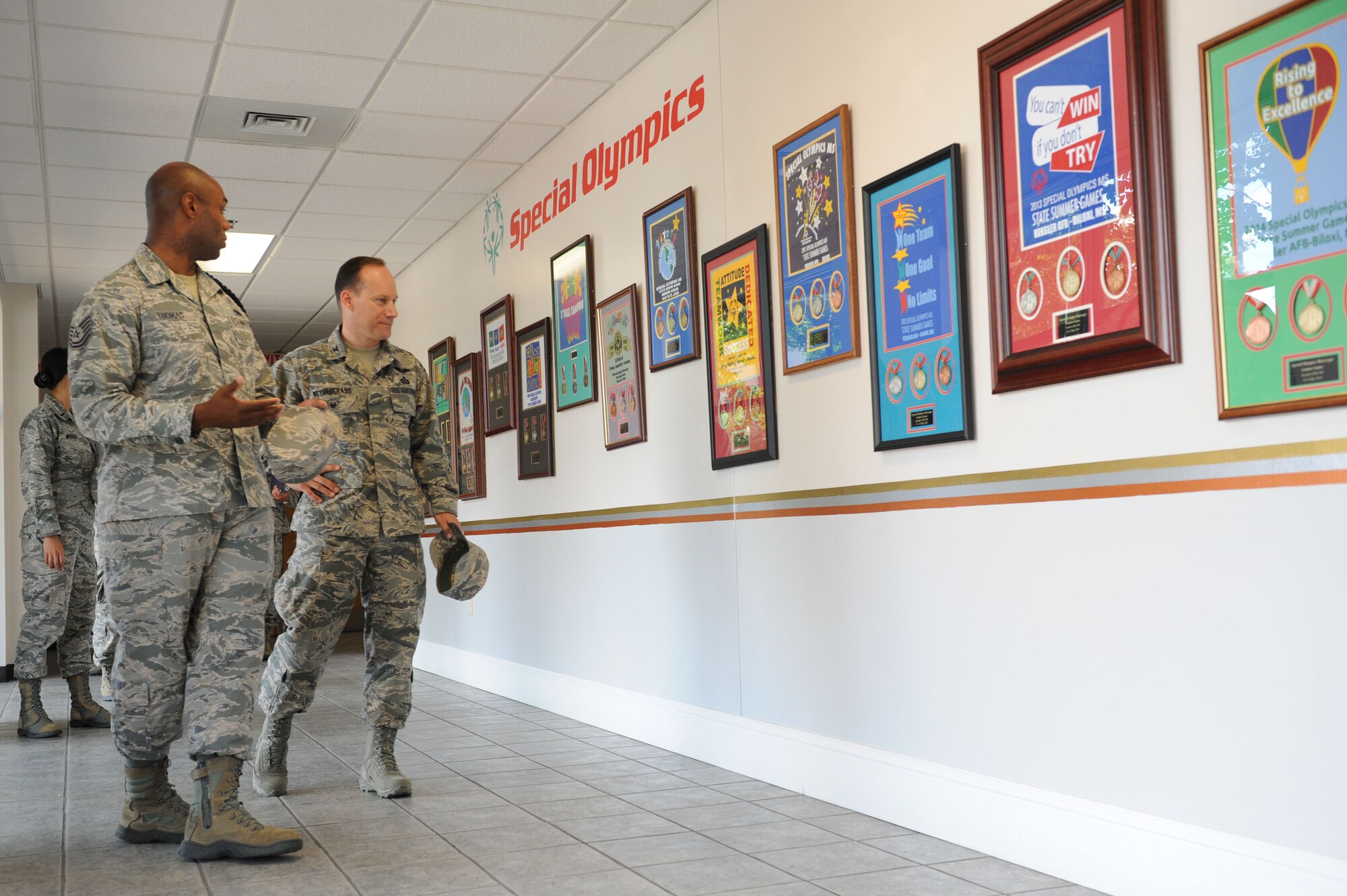 Tech. Sgt. James Thomas, 81st Training Group military training leader, briefs Col. Todd Weyerstrass, 2nd Air Force vice commander, on Keesler’s involvement with Special Olympics Mississippi Summer Games during an 81st Training Wing orientation tour at the Levitow Training Support Facility July 12, 2016, on Keesler Air Force Base, Miss. The purpose of the tour was to become familiar with the wing’s mission, operations and personnel. (U.S. Air Force photo by Kemberly Groue/Released)