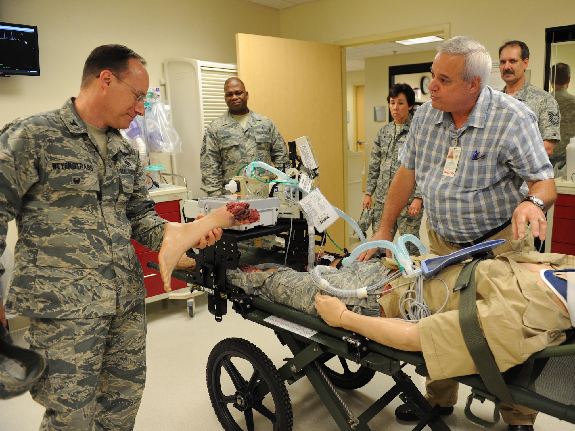 Randy Bernhardt, 81st Medical Group medical simulation coordinator, briefs Col. Todd Weyerstrass, 2nd Air Force vice commander, on the mannequin simulators used for training at the Keesler Medical Center during an 81st Training Wing orientation tour July 12, 2016, on Keesler Air Force Base, Miss. The purpose of the tour was to become familiar with the wing’s mission, operations and personnel. (U.S. Air Force photo by Kemberly Groue/Released)